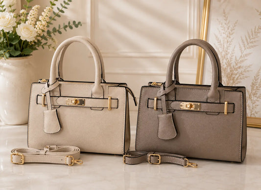 Sac à main élégant en simili cuir grainé avec détails dorés et bandoulière incluse, chic et moderne pour femme.