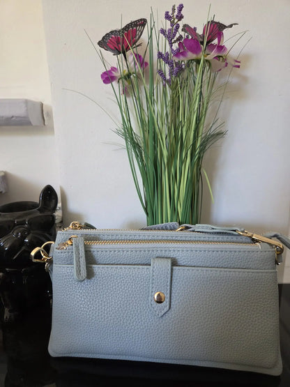 Petit sac bandoulière femme multi-poches effet cuir avec compartiments zippés et rangement cartes intégré.